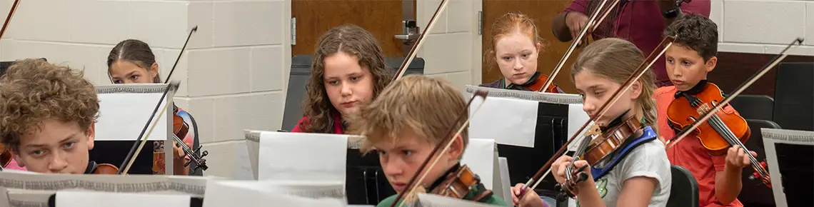 Children playing violins