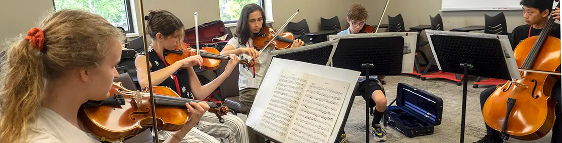 Young people playing violins