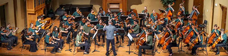 young people playing in orchestra