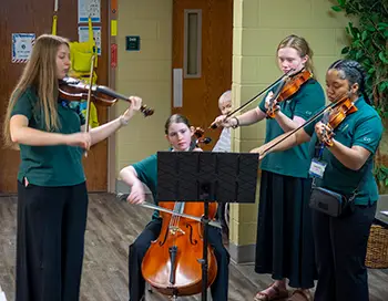 string quartet playing for patients