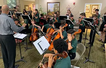 young people playing string music