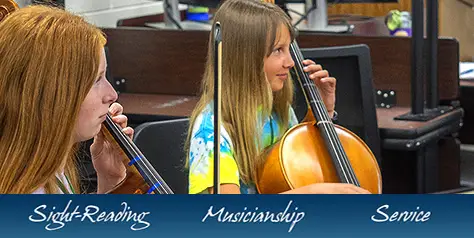 two girls playing cellos